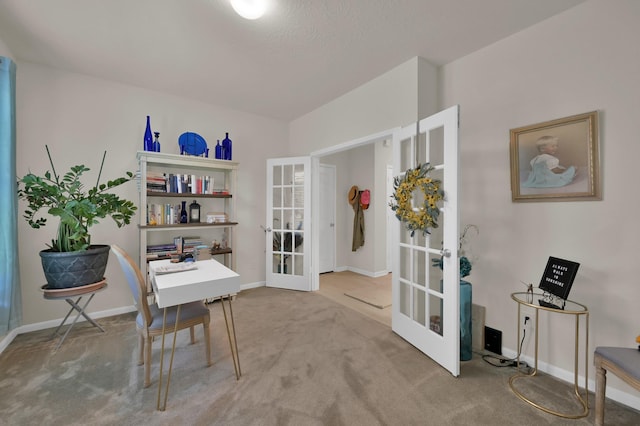 office space with baseboards, french doors, and carpet