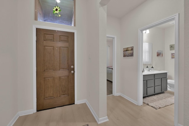 entrance foyer featuring light wood-style flooring