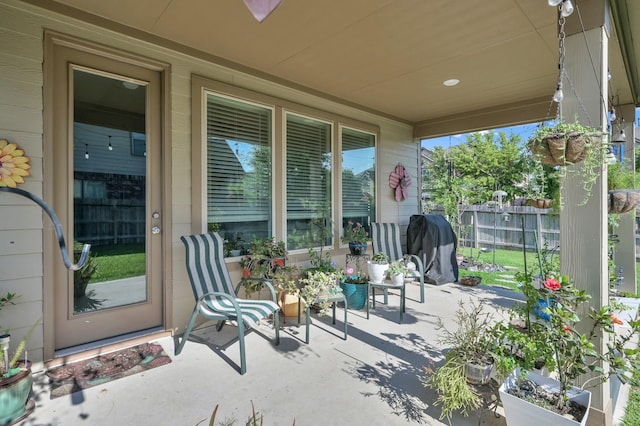 view of patio featuring fence