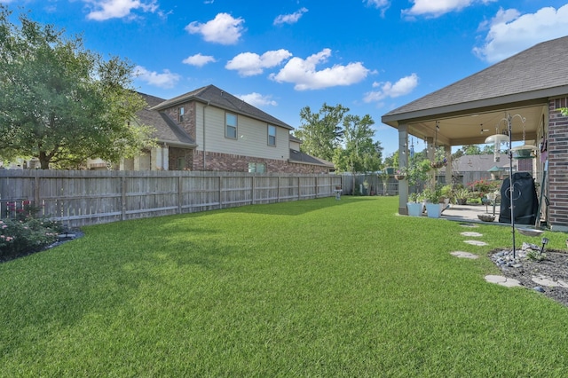 view of yard with a fenced backyard