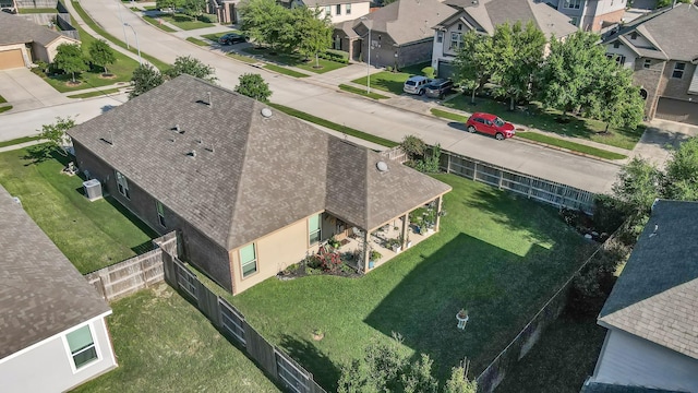 birds eye view of property with a residential view