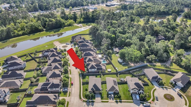 bird's eye view with a residential view and a water view
