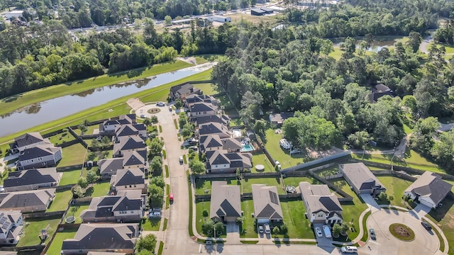 bird's eye view with a water view and a residential view