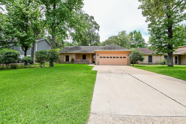 3306 Sycamore Springs Dr, Houston, TX 77339 - ranch-style home with an attached garage, concrete driveway, a front lawn, and brick siding