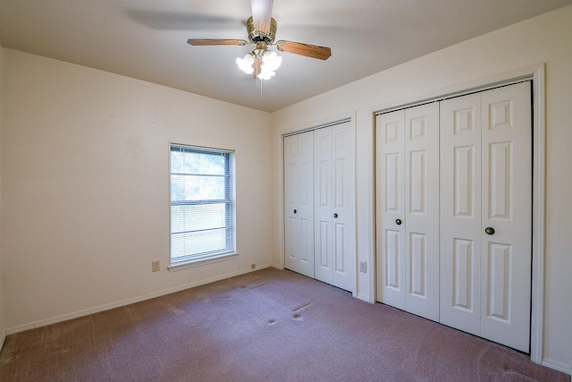 3306 Sycamore Springs Dr, Houston, TX 77339 - unfurnished bedroom featuring multiple closets, carpet flooring, baseboards, and ceiling fan