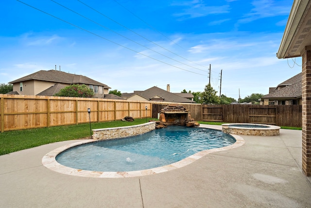 view of pool featuring a patio, a fenced backyard, and a pool with connected hot tub
