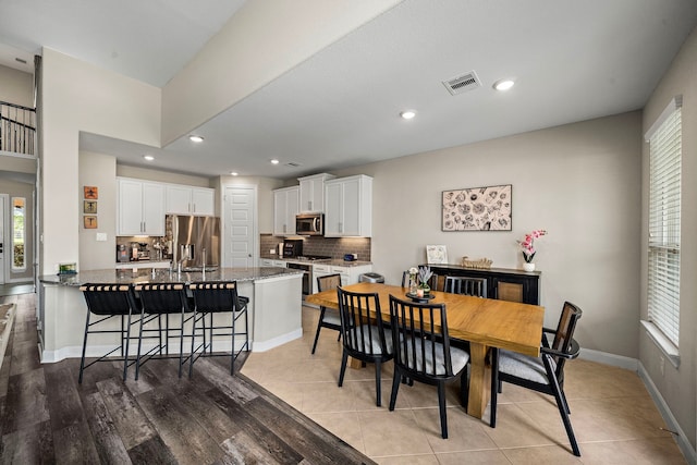 dining area with plenty of natural light, recessed lighting, and visible vents