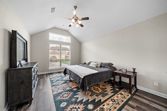 bedroom with a ceiling fan, baseboards, lofted ceiling, dark wood-type flooring, and visible vents
