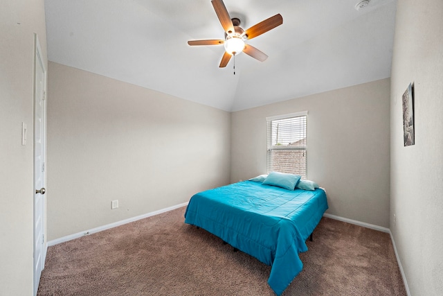 carpeted bedroom featuring baseboards, a ceiling fan, and vaulted ceiling