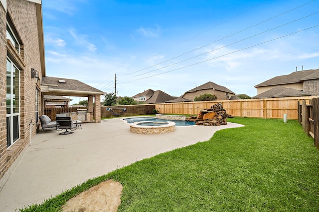 view of yard with a fenced backyard, a pool with connected hot tub, and a patio area