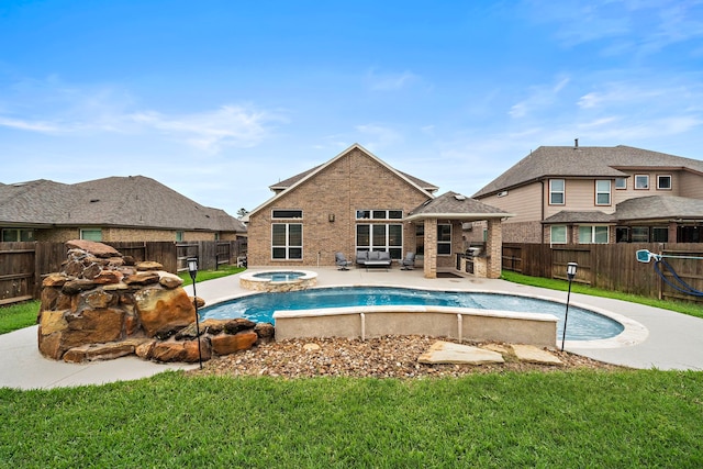 view of pool with an in ground hot tub, a lawn, a patio area, a fenced in pool, and a fenced backyard