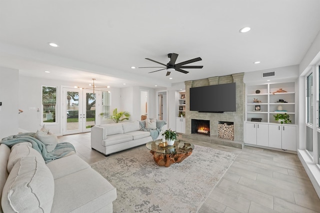10 Quintana Pl, Galveston, TX 77554 - living room with visible vents, recessed lighting, ceiling fan with notable chandelier, and a large fireplace