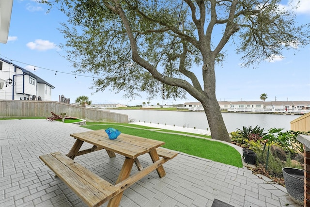 10 Quintana Pl, Galveston, TX 77554 - deck with a lawn, a water view, a patio area, and fence