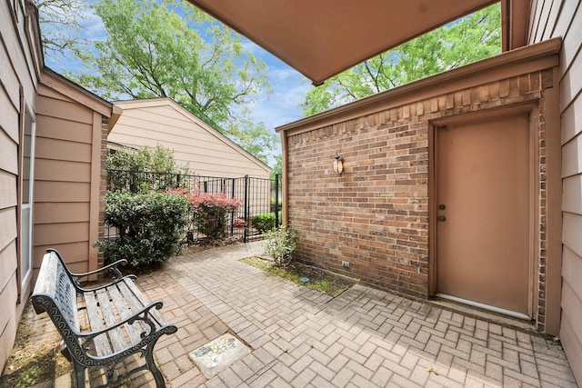 view of patio featuring fence