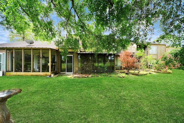view of yard featuring a sunroom