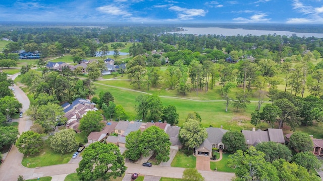 drone / aerial view with a residential view and a water view
