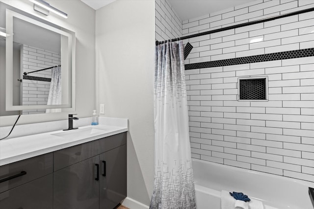 full bathroom with shower / tub combo with curtain, vanity, and baseboards
