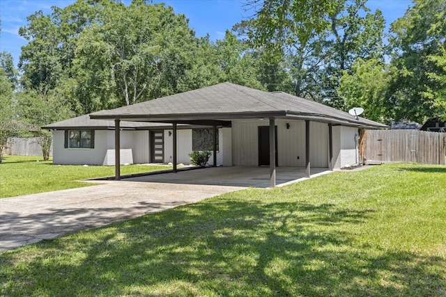 view of front of property with concrete driveway and a carport