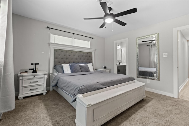 bedroom with carpet flooring, baseboards, ensuite bathroom, and ceiling fan