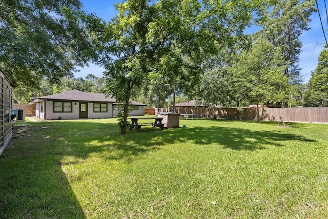 view of yard with central AC unit