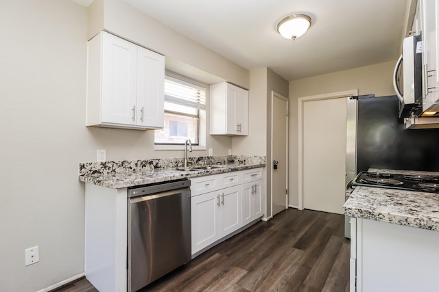 23314 Goodfellow Dr, Spring, TX 77373 - kitchen featuring a sink, appliances with stainless steel finishes, dark wood-style floors, and light stone counters