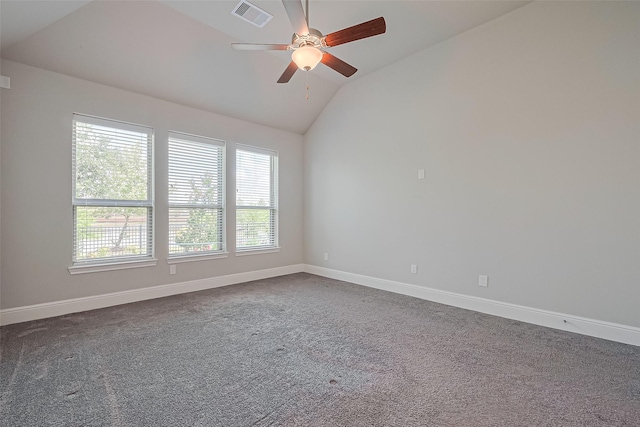 empty room with a ceiling fan, baseboards, vaulted ceiling, and visible vents
