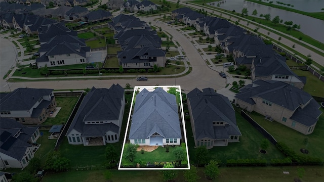 birds eye view of property with a residential view