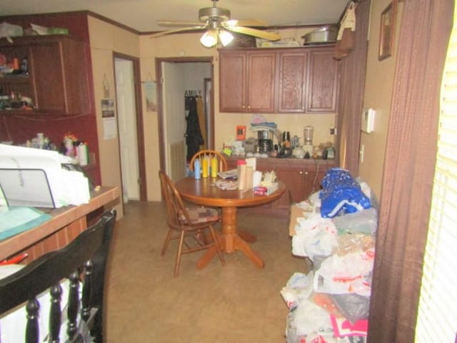 kitchen with brown cabinetry and a ceiling fan