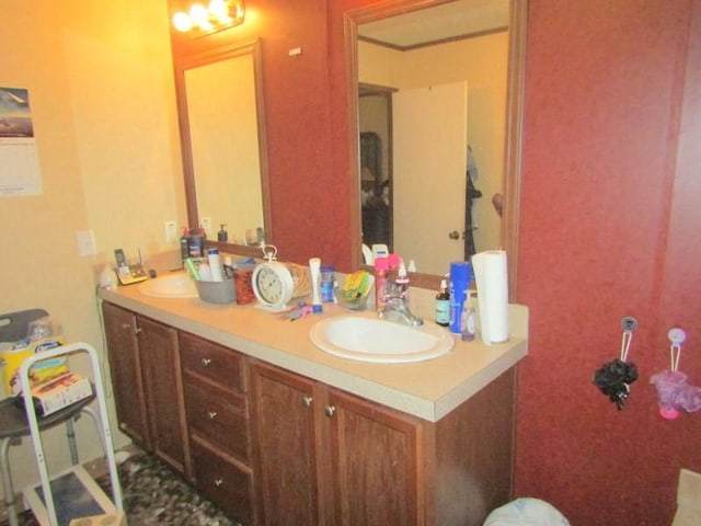 full bath featuring double vanity and a sink