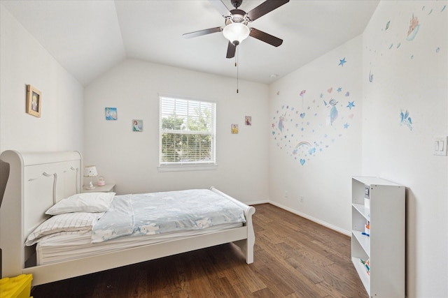 bedroom featuring baseboards, a ceiling fan, vaulted ceiling, and wood finished floors