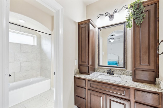 bathroom with vanity, a ceiling fan, and bathtub / shower combination