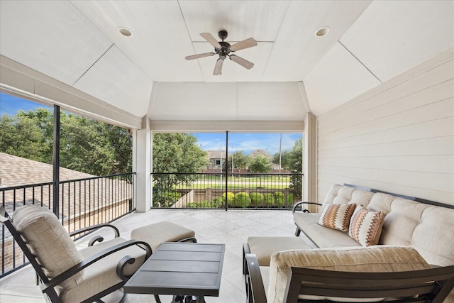 sunroom featuring plenty of natural light, a ceiling fan, and outdoor lounge area