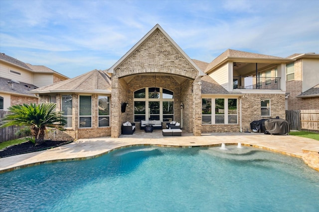 view of pool with fence, area for grilling, an outdoor living space, a fenced in pool, and a patio area