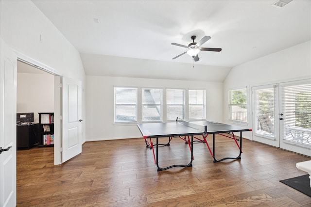 recreation room with french doors, a ceiling fan, vaulted ceiling, and wood finished floors