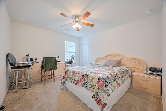 bedroom featuring ceiling fan, light colored carpet, and visible vents