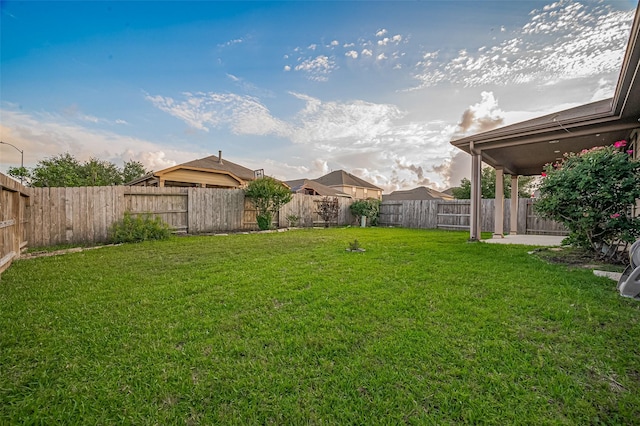view of yard with a fenced backyard