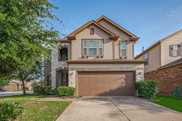 view of front of house featuring an attached garage, driveway, and stone siding