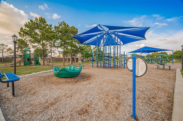 community jungle gym featuring fence
