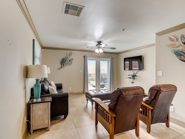 living room featuring visible vents, a ceiling fan, crown molding, and light tile patterned floors