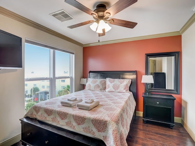 bedroom featuring visible vents, ornamental molding, and dark wood-style flooring