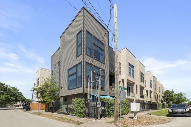 view of building exterior featuring fence