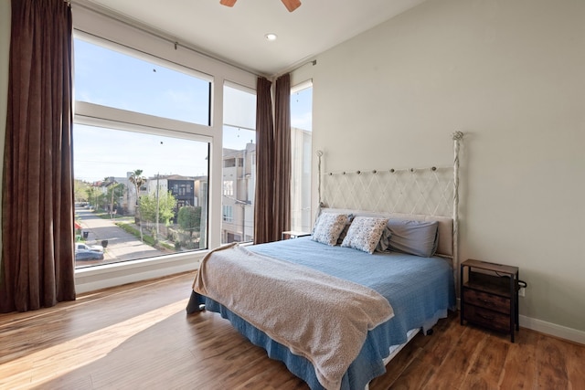 bedroom featuring baseboards, ceiling fan, recessed lighting, and wood finished floors