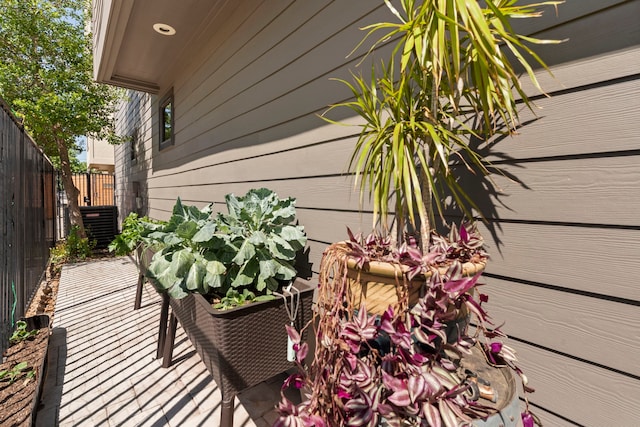 exterior space featuring fence and central air condition unit