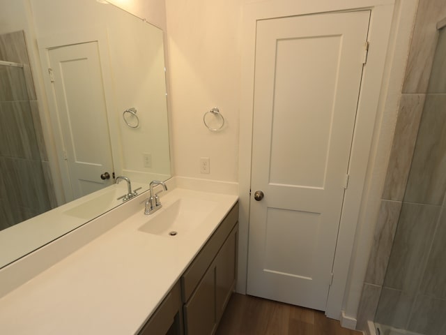8107 Kay Harbor Dr, Cypress, TX 77433 - full bathroom featuring vanity, wood finished floors, and a shower