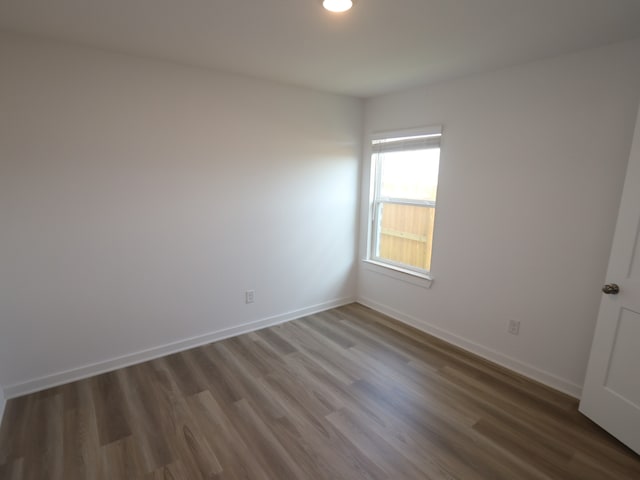 8107 Kay Harbor Dr, Cypress, TX 77433 - spare room featuring wood finished floors, baseboards, and recessed lighting