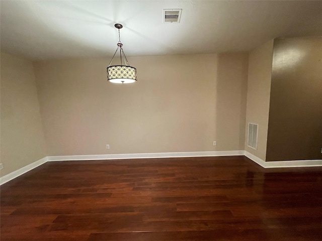 1718 Elgin St, Houston, TX 77004 - spare room featuring dark wood-type flooring and baseboards