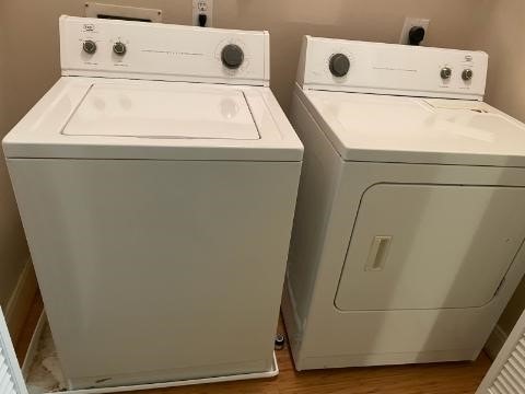 1718 Elgin St, Houston, TX 77004 - clothes washing area with separate washer and dryer and wood finished floors