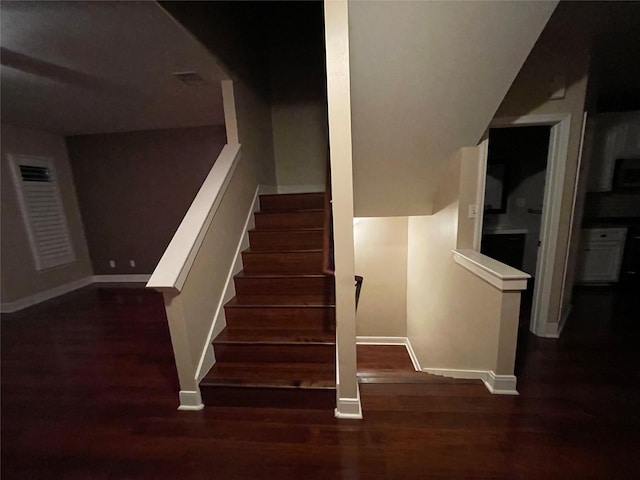 1718 Elgin St, Houston, TX 77004 - stairway featuring wood finished floors and baseboards