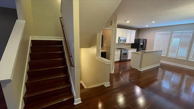 1718 Elgin St, Houston, TX 77004 - staircase featuring wood finished floors, baseboards, and recessed lighting