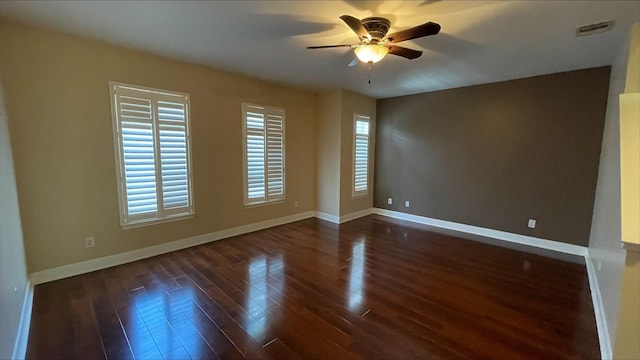 1718 Elgin St, Houston, TX 77004 - empty room with a ceiling fan, dark wood finished floors, healthy amount of natural light, and baseboards